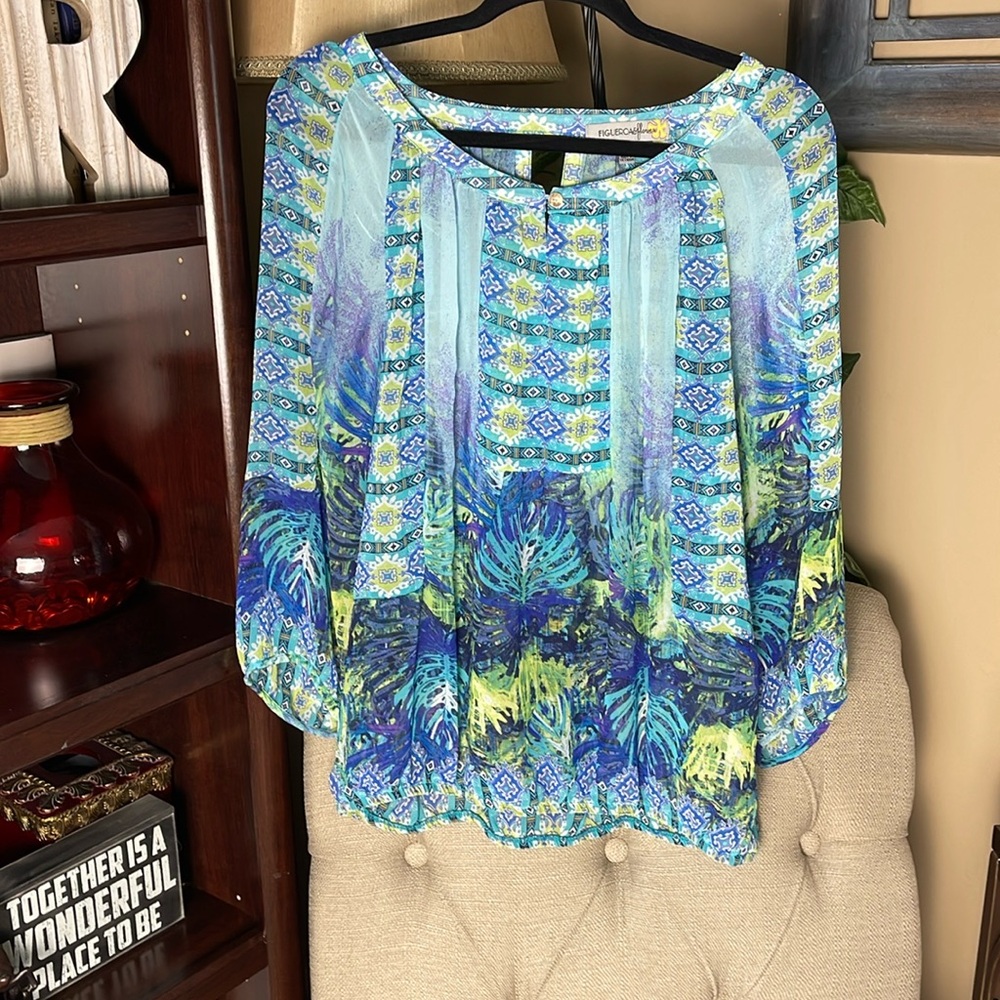 Gorgeous semi sheer top with palm pattern.
